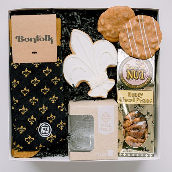 The Basketry the New Orleans Gentleman socks, rock glass, and snack gift box