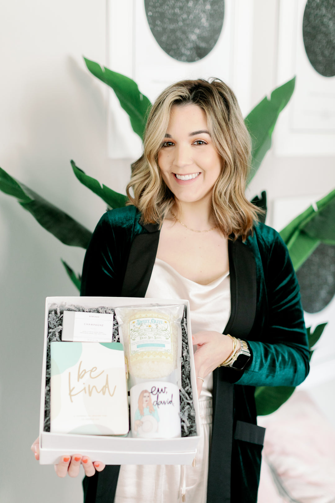 Ali holding a gift box