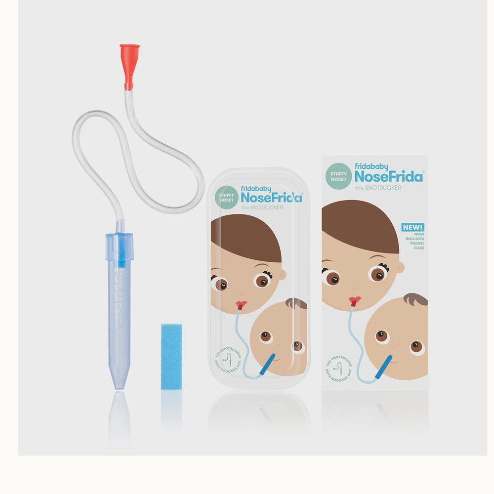 Studio product photograph by Fridababy of the NoseFrida The Snotsucker nasal aspirator kit featuring a bright red mouthpiece, a blue hygiene filter, and an illustrated travel case on a neutral grey background