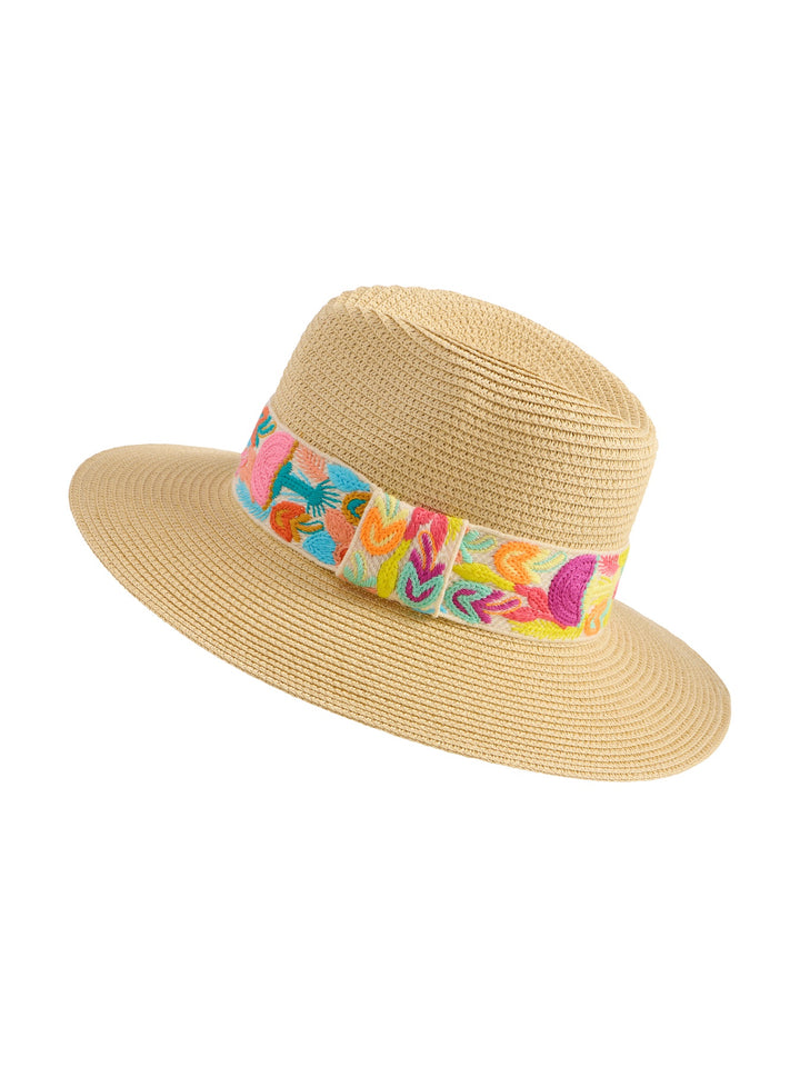 Woven straw sun hat featuring a wide brim and a colorful decorative band with vibrant pink, turquoise, and yellow embroidered floral motifs against a plain white background