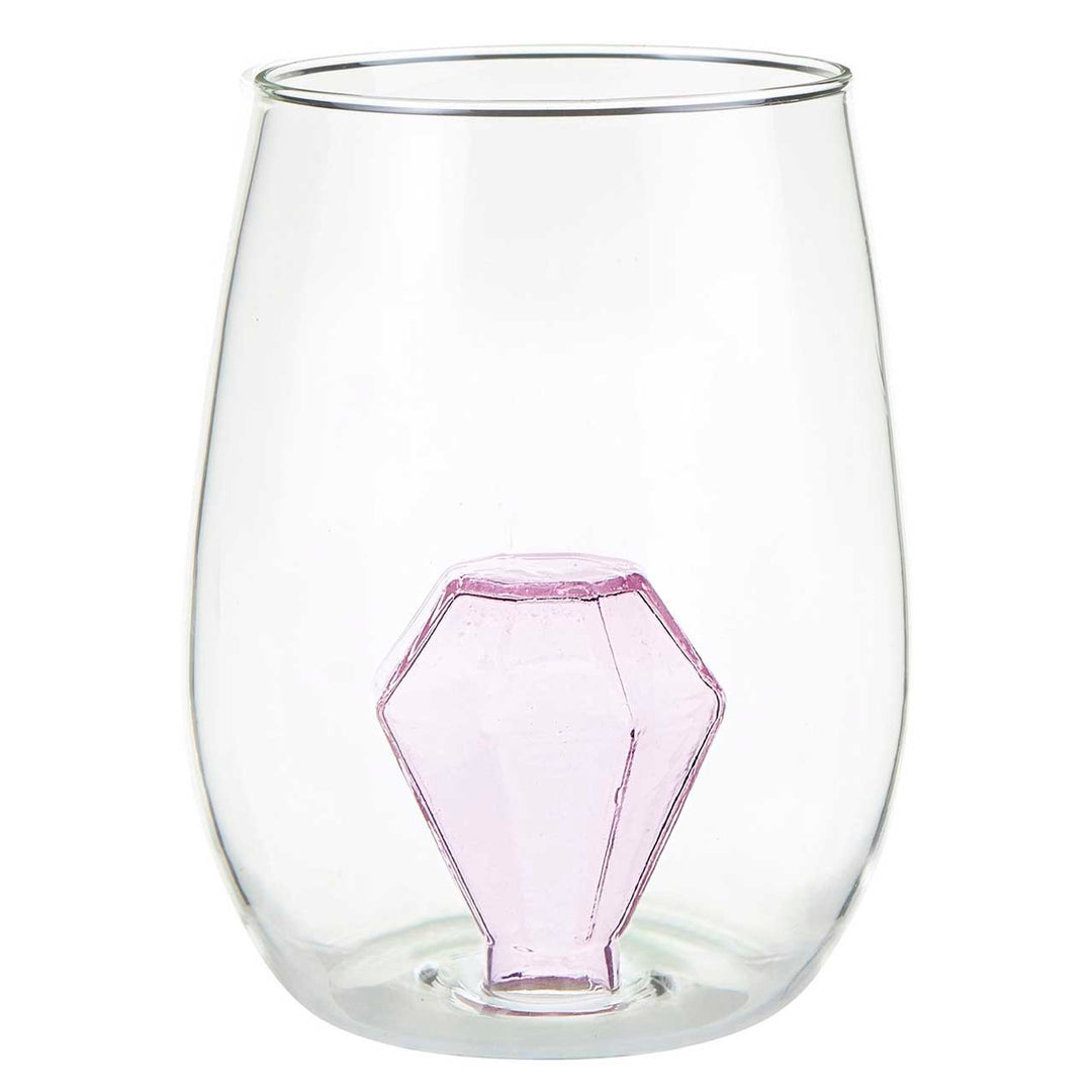Hand-blown glass stemless wine glass featuring a faceted pink diamond sculpture as the central landmark at the base of the clear vessel against a white background