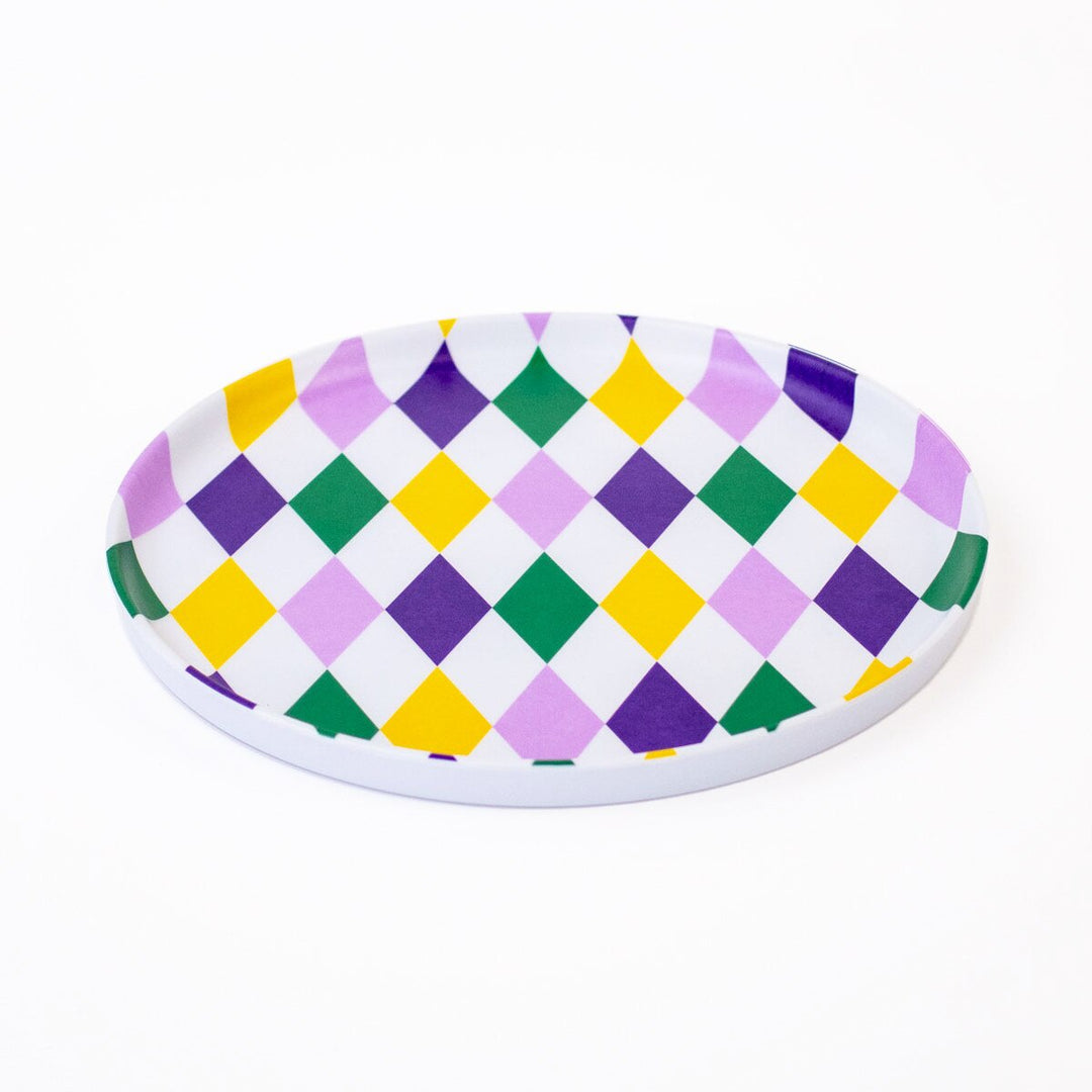 Round melamine plate with purple, green, gold and lavender harlequin diamond pattern