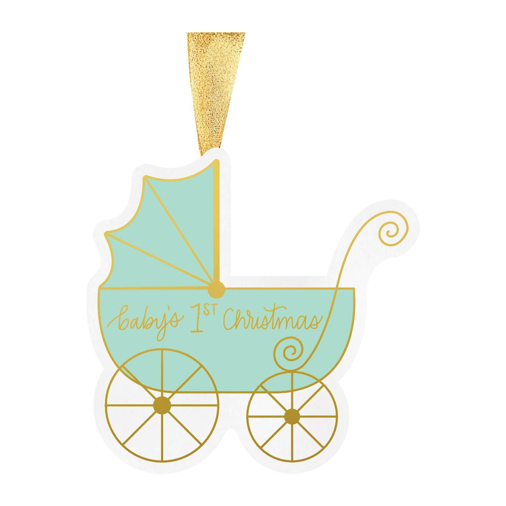 Illustrated paper Christmas ornament of a mint green baby pram against a white background featuring gold cursive text reading baby's 1st Christmas, ornate spoked wheels, and a shimmering gold ribbon loop