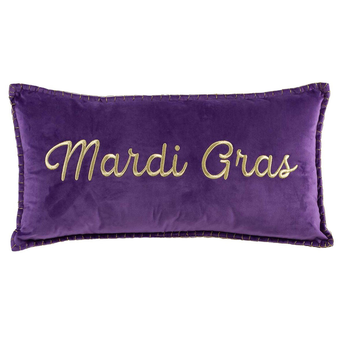 Purple velvet lumbar pillow embroidered with "Mardi Gras" in gold script