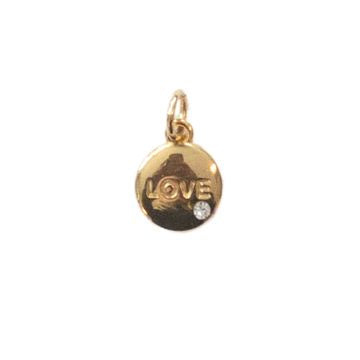 Gold-tone metal jewelry charm featuring the embossed word LOVE with a spiral letter O and an inset clear gemstone centered on a plain white background
