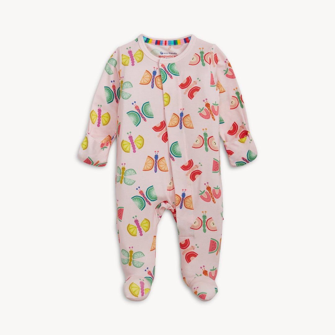 Fabric garment by Magnetic Me showcasing a pink baby footie with a pattern of butterflies with fruit-slice wings and a rainbow-striped collar on a plain white background