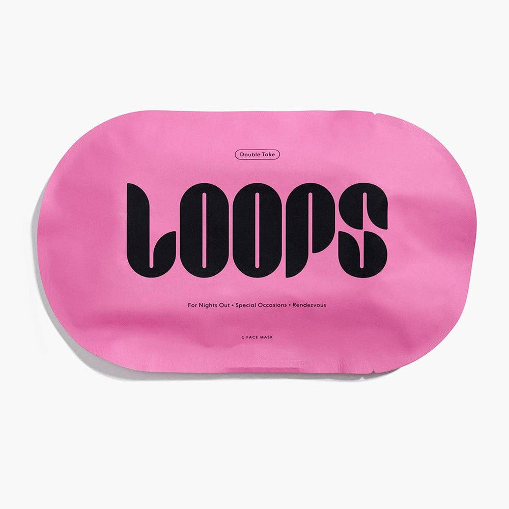 Product photograph of a LOOPS Double Take face mask featuring a bright bubblegum pink oval-shaped pouch with bold black stylized typography on a clean white studio background