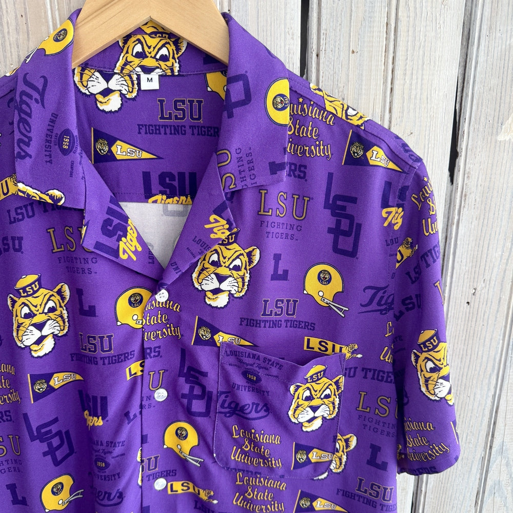 Purple button-up shirt on a hanger printed with LSU Fighting Tigers logos, tigers and pennants