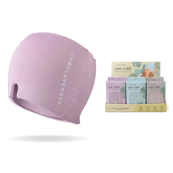 Product photograph for Lemon Lavender showcasing a lavender Out Cold Temp-Smart Migraine Cap featuring a U-shaped nose cutout and vertical white branding alongside a colorful retail display on a clean white background