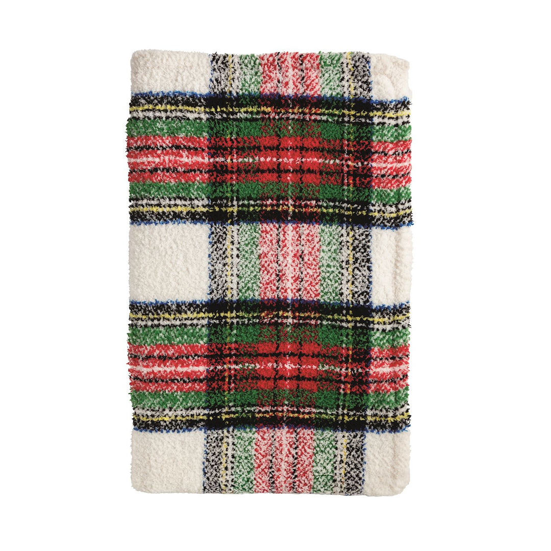 Textured textile throw blanket featuring a classic red, green, and black tartan pattern on a soft white background with a plush fuzzy pile
