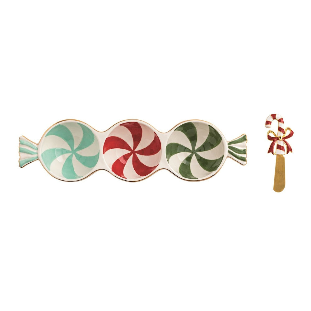 Triple dish shaped like three peppermint candies in mint, red and green with a candy cane spreader