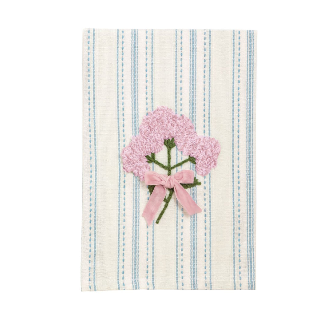 Embroidered linen towel featuring a central bouquet of pink French knot flowers tied with a soft pink velvet ribbon bow against a background of thin light blue vertical stripes