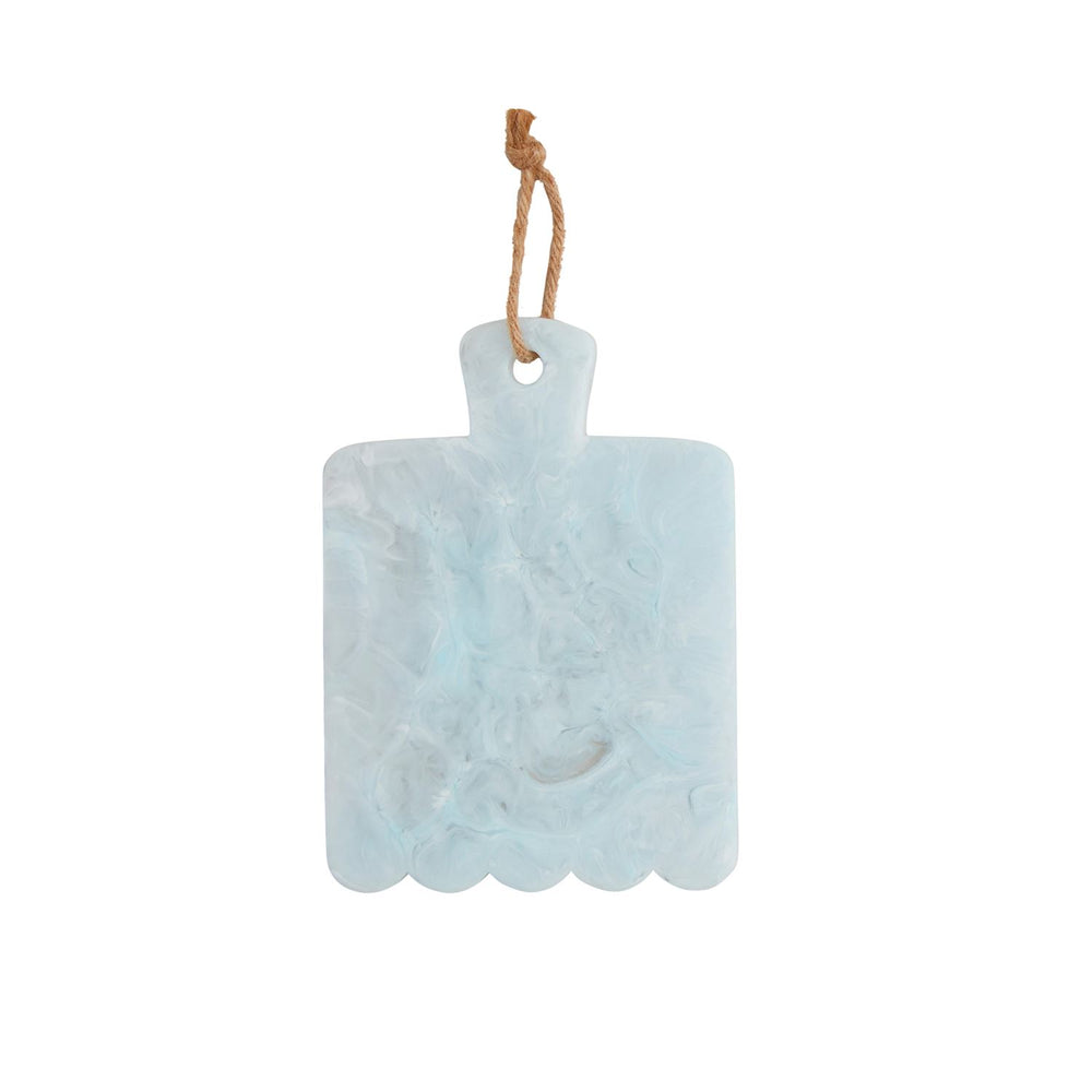Marbled resin serving board by an artisan designer featuring a rectangular subject against a white background with translucent sky blue swirls, a scalloped bottom edge, and a rustic jute rope hanging loop