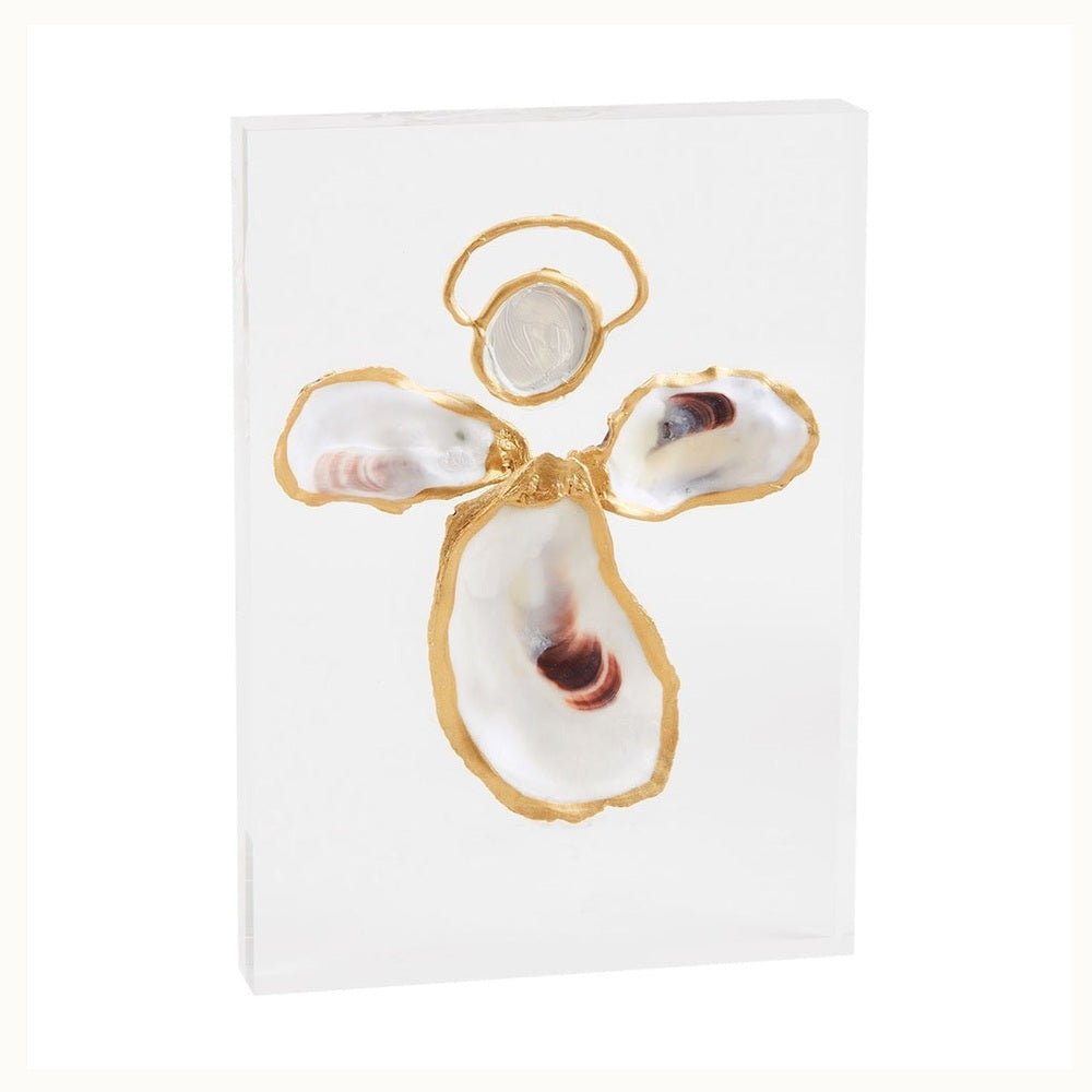 Mixed media sculpture by Grit and Grace Studio of an oyster shell angel centered on a clear acrylic block with hand-painted gold gilded edges and natural purple-toned muscle scars