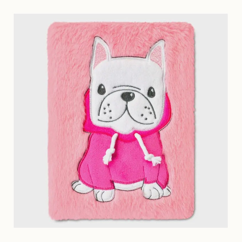 Plush faux-fur notebook cover featuring a white French bulldog in a vibrant pink hoodie with white drawstrings and glittery pink inner ears centered on a soft pink background