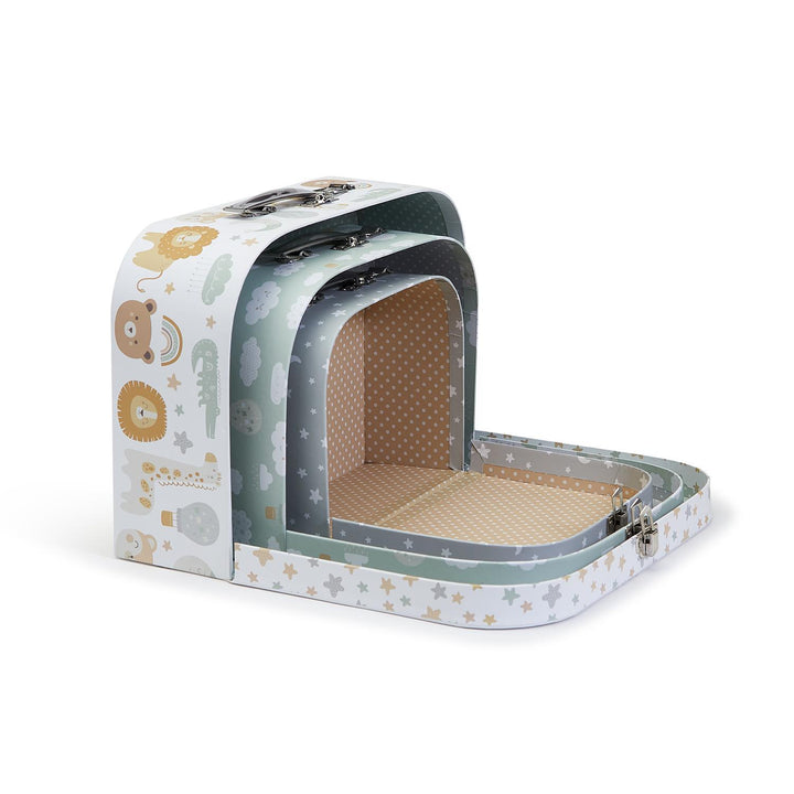 Cardboard nesting storage suitcases for children featuring pastel safari animal illustrations including lions and giraffes on a white background with polka-dot interior lining and silver metal clasps