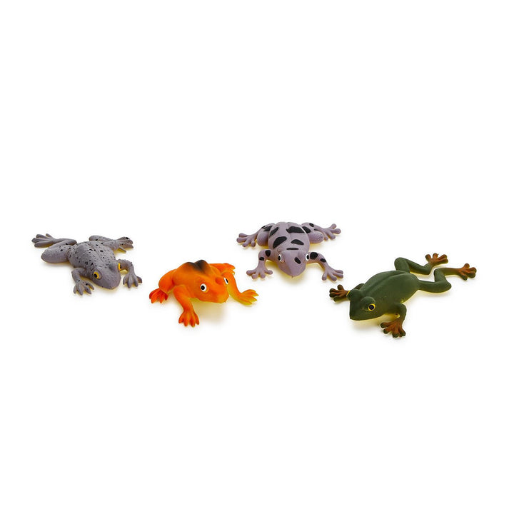Toy figurines of four colorful frogs on a plain white background, featuring a vibrant orange frog, a lavender frog with large black spots, and a dark green frog with reddish-brown feet