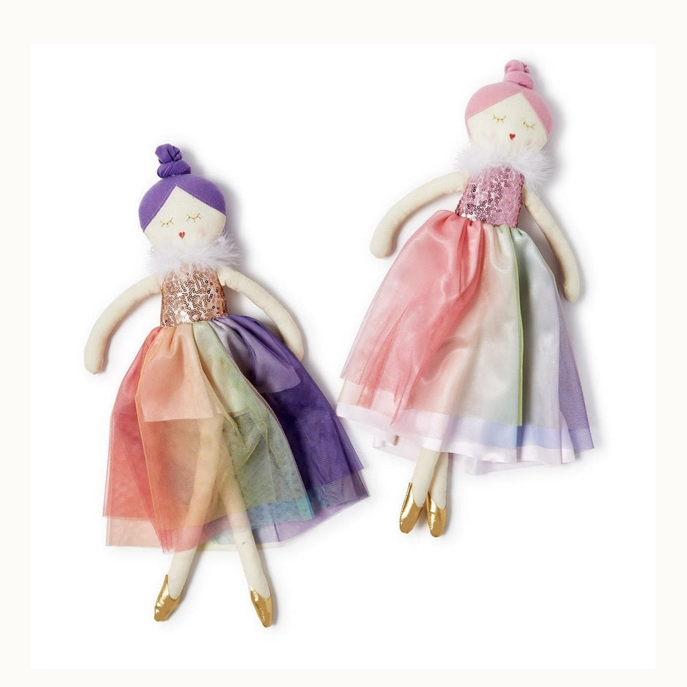 Handcrafted textile dolls by Meri Meri depicting two ballerinas against a white studio background dressed in iridescent sequin bodices, multi-toned rainbow tulle skirts, and gold foil slippers