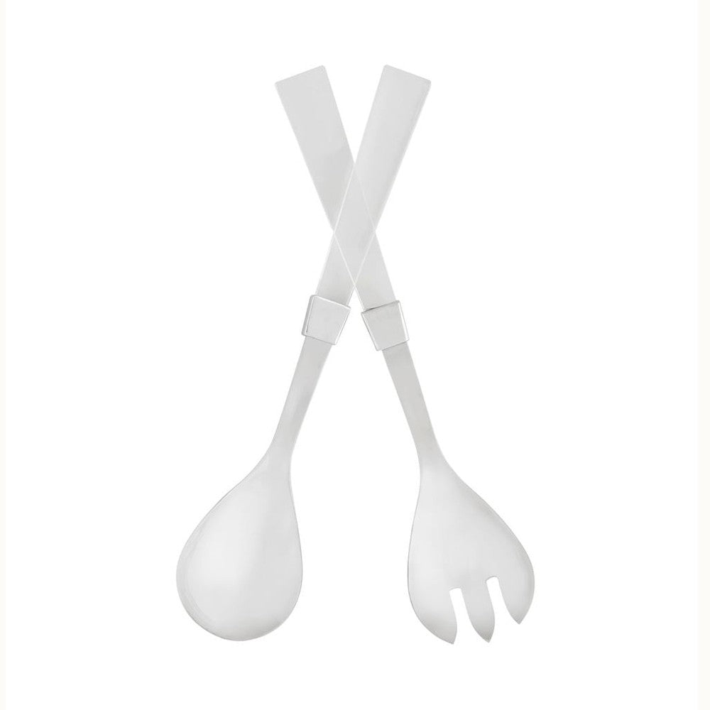 Polished white resin and silver-tone metal modern salad servers arranged in a crisscross pattern on a minimalist white background featuring a round spoon, a three-tined fork, and square metallic collars