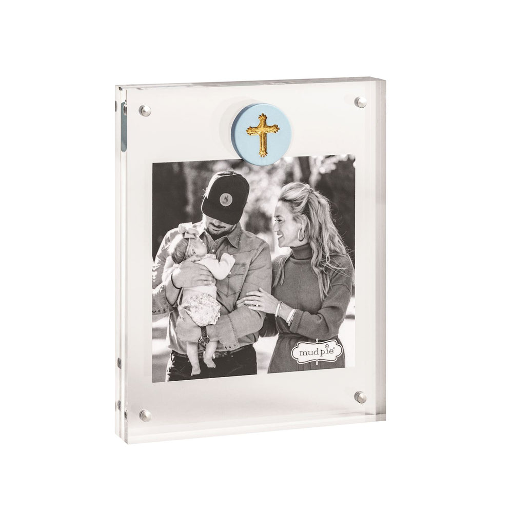 Mud Pie acrylic magnetic block frame showcasing a black and white family portrait featuring a light blue circular medallion with a gold-textured cross and four polished silver magnetic corner fasteners