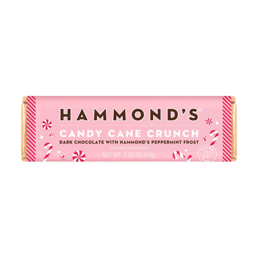 Product photograph of Hammond’s Candy Cane Crunch dark chocolate bar featuring a light pink wrapper with festive red peppermint illustrations and a prominent brand logo on a white background