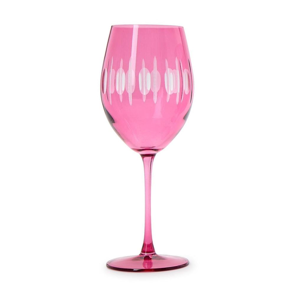 Etched glass wine glass centered on a white background featuring a vibrant fuchsia tint, decorative vertical frosted oval patterns, and a slender tall stem