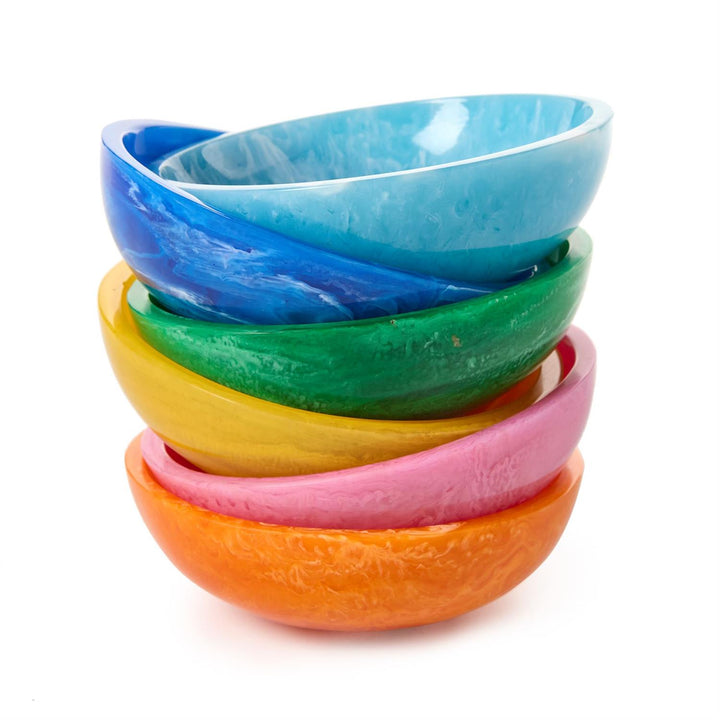 Handcrafted resin bowls by Dinosaur Designs stacked vertically on a white background featuring vibrant marbled textures in shades of teal, emerald, and orange with organic-shaped rims