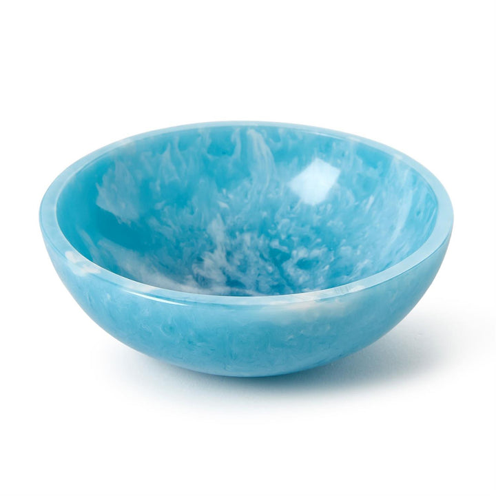 Resin bowl on a white studio background featuring a vibrant sky blue color with delicate white marbling and a polished translucent finish