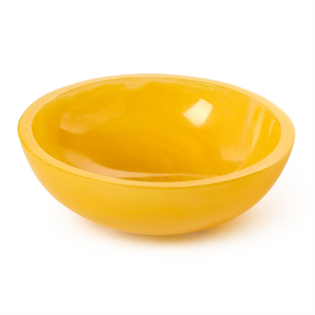 Polished resin decorative bowl in a vibrant sunny yellow hue centered on a white background featuring a high-gloss reflective interior and a thick translucent rim