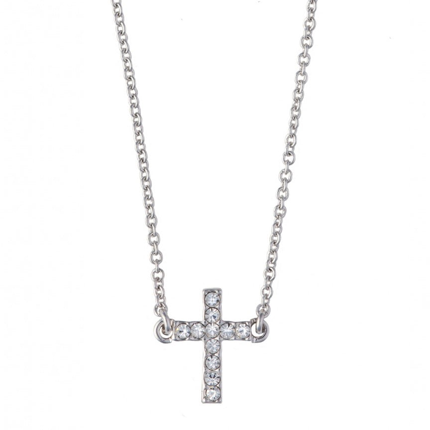 Silver-tone jewelry featuring a crystal-encrusted cross pendant centered against a white background with twelve shimmering round-cut clear stones and a delicate cable link chain