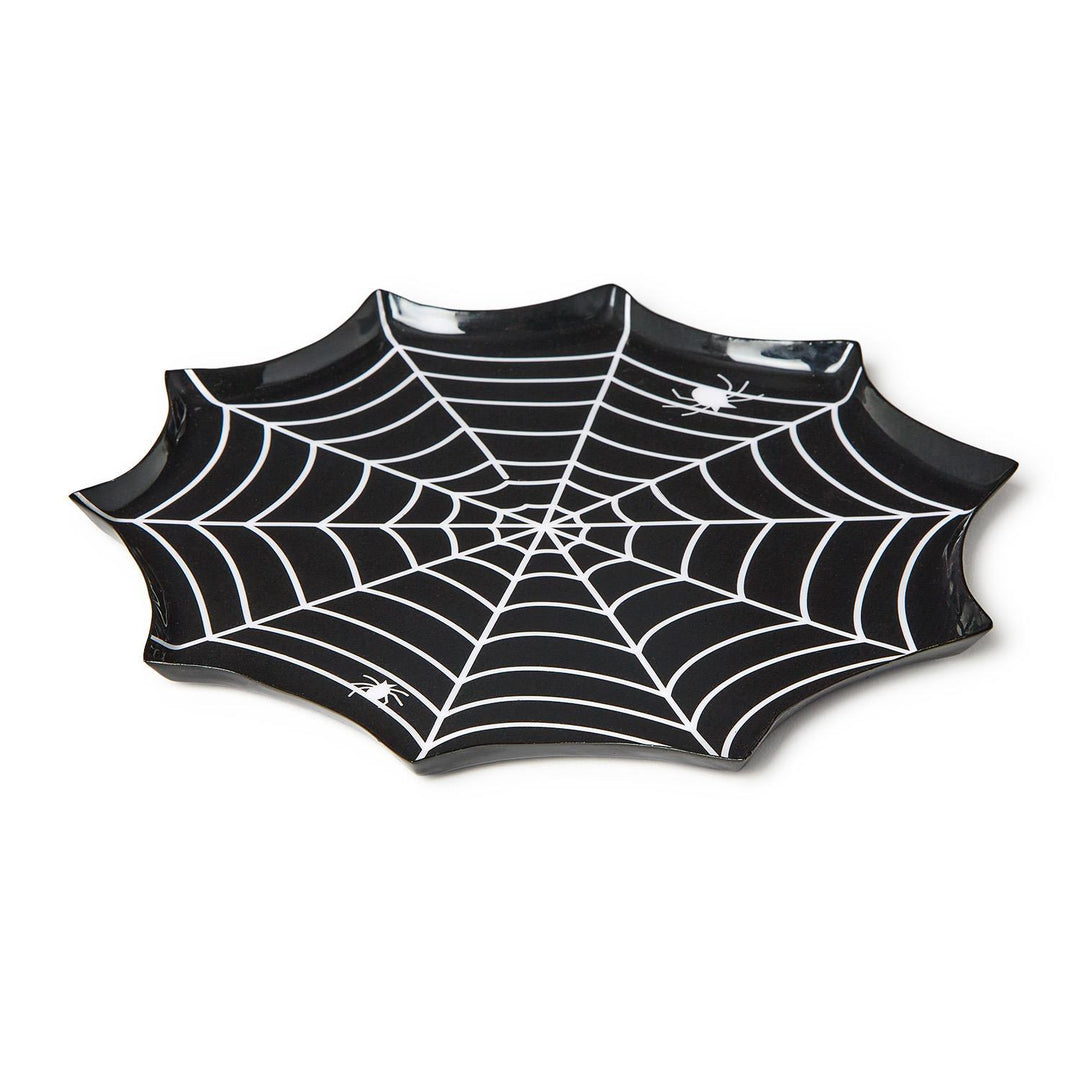 Angled view of a black spiderweb-shaped plate with white web lines