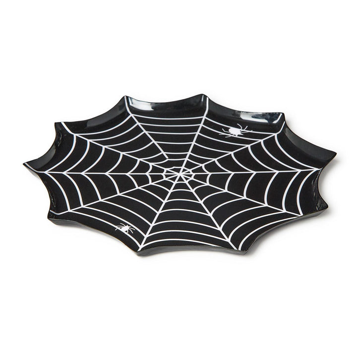 Angled view of a black spiderweb-shaped plate with white web lines