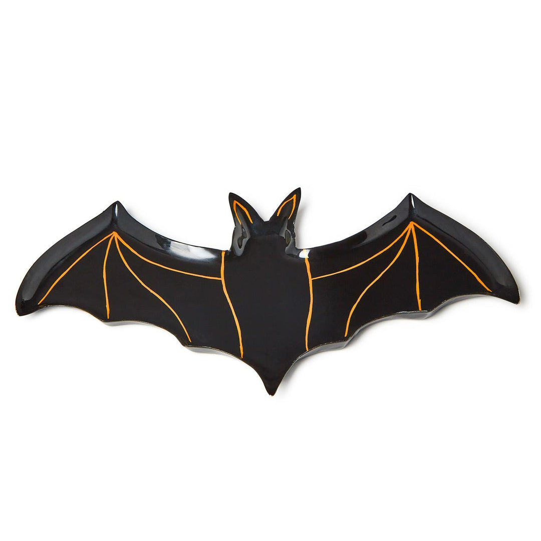 Angled view of a black bat-shaped plate with orange wing lines