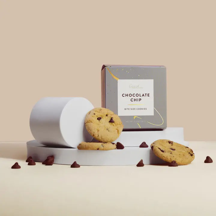 Gray Grand Provisions Chocolate Chip bite size cookies box with cookies and chocolate chips around it