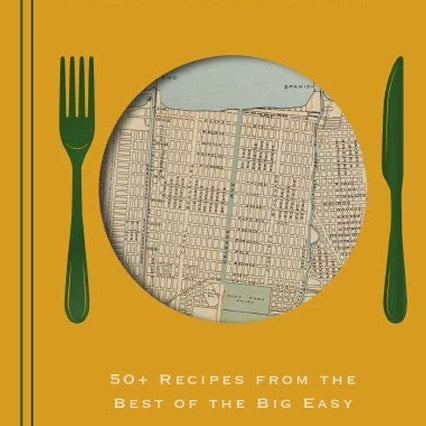 Graphic book cover illustration by Beth D'Addono for City Eats New Orleans showcasing a vintage street map highlighting Orleans Avenue inside a circular plate flanked by a dark green fork and knife on a vibrant mustard yellow background