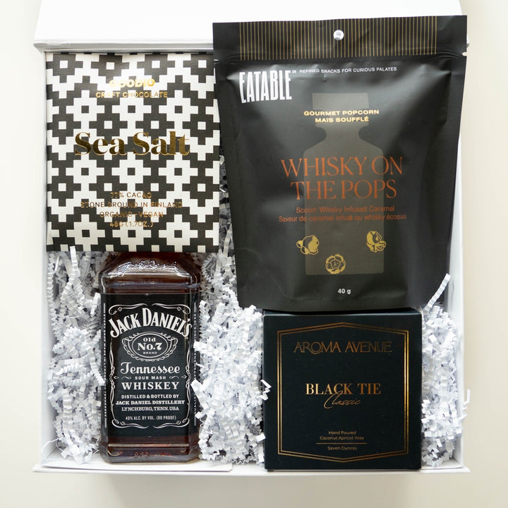 Photograph of a curated luxury gift box featuring a Jack Daniel&