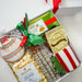 Gift box with cookies, popcorn, and candy on a white background