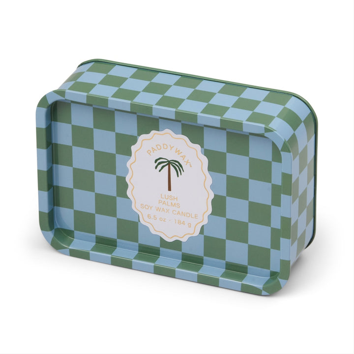 Paddywax soy wax candle in a rectangular metal tin featuring the Lush Palms scent on a white background with a sage green and light blue checkered pattern and a scalloped label with a central palm tree icon
