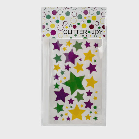 Stationery stickers by Glitter Joy featuring a sheet of assorted star stickers centered in clear packaging, showcasing a branded decorative header with multicolored circles and vibrant purple, green, and yellow five-pointed stars in various sizes