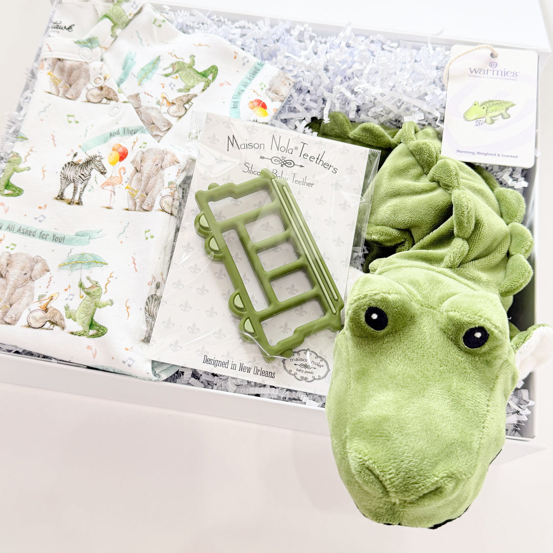 Green plush toy dinosaur with a children&