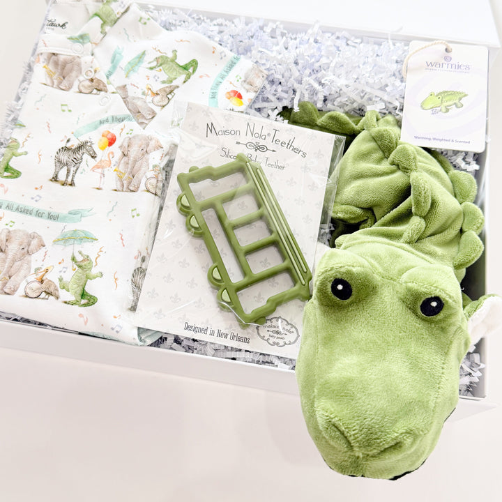 Green plush toy dinosaur with a children&