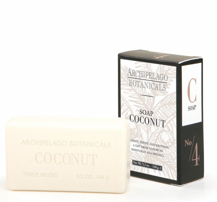 Product photograph of Archipelago Botanicals Coconut bar soap and packaging on a white background featuring a creamy triple milled bar, a black box with copper-toned numbering, and an elegant palm leaf pattern