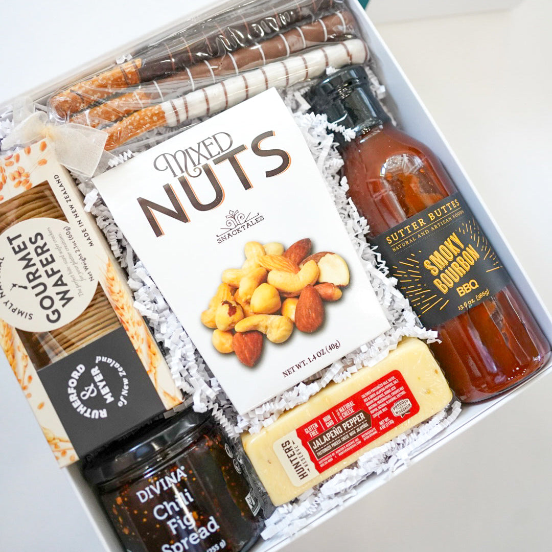 Gift box with snacks and drinks on a white background