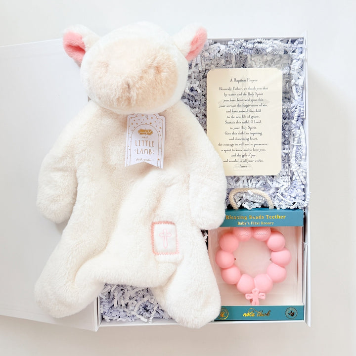 White plush toy with pink accents and a card on a white background