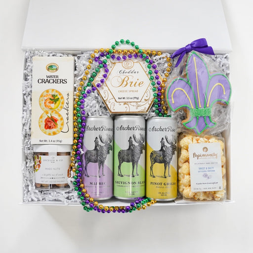 Gift set with beer, snacks, and decorative items on a white background