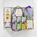 Gift set with beer, snacks, and decorative items on a white background