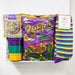 Colorful gift box with Zapp's potato chips, striped socks, and plastic cups on a white background