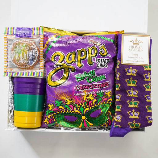 Mardi Gras-themed gift set with Zapp's potato chips, cups, and socks on a white background