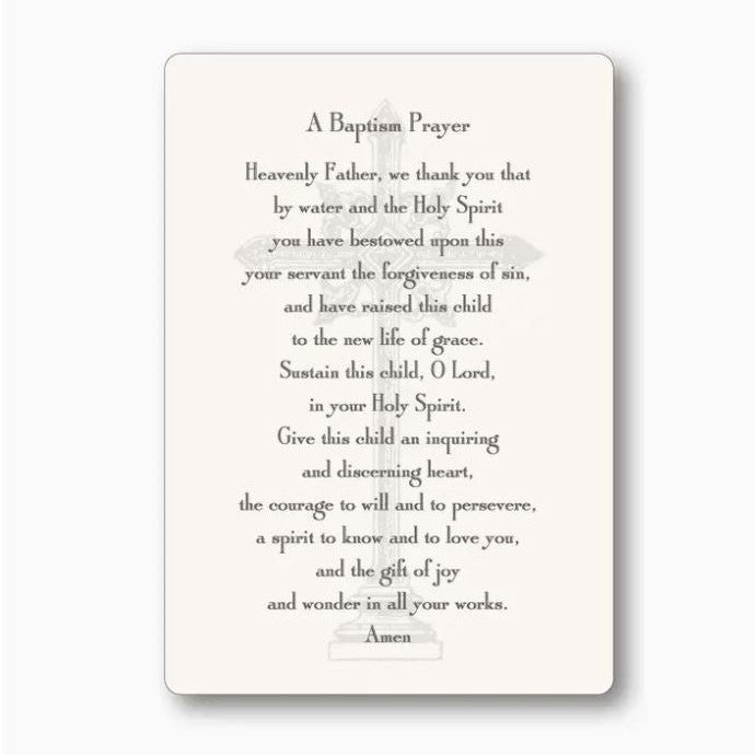 Printed prayer card featuring a baptismal prayer in elegant serif font centered over a faint grey ornate cross watermark on a cream-colored background with rounded corners