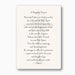 Printed prayer card featuring a baptismal prayer in elegant serif font centered over a faint grey ornate cross watermark on a cream-colored background with rounded corners
